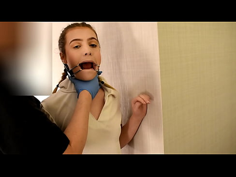 Teenage girl Daisy Bean tries wearing an open mouth gag for Joe Jon's sadistic pleasure