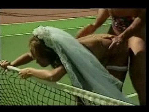 Asian bride on a tennis court