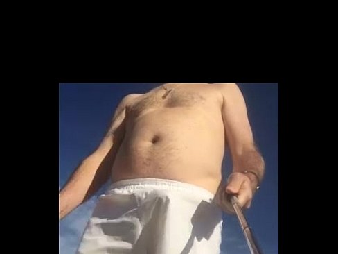 Guy in white boxers with stiffie on beach