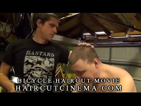 Guy Gets Haircut Haircut on Bicycle in Garage