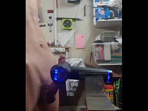 Naked teen shoots cum using a massage gun