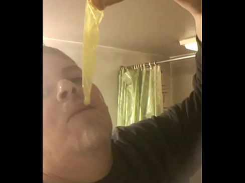 Faggot eats cum filled condom