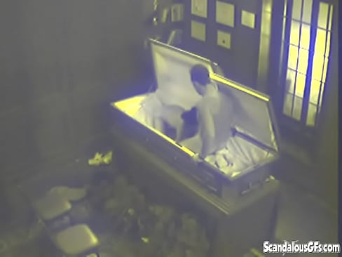 Two People having sex in a Coffin before the service