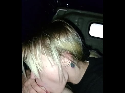 Hot babe gives blowjob on the back of the car in the middle of the town