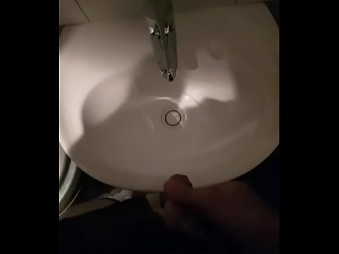 Man pissing in sink in restuarant