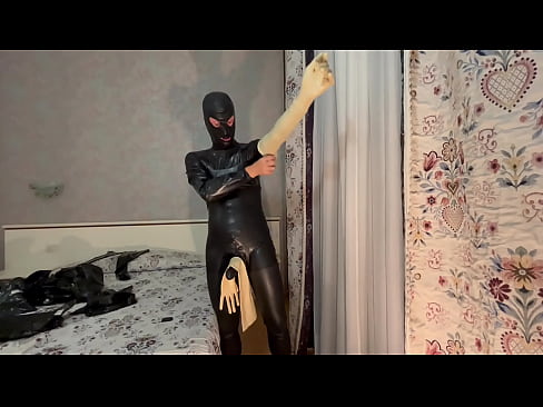 Latexitaly prepares himself as a latexdoll wearing rubber gloves