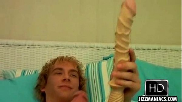 This sexy twink with a tattoo uses a dildo on himself