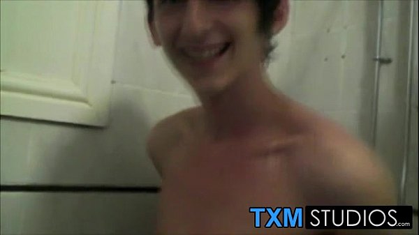 An uncut twink Max Brown takes a shower and starts wanking