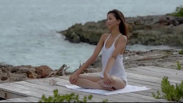 Asian angel undressing by the ocean