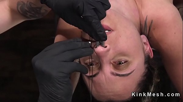 Slave bent over strapped with hair pulled back