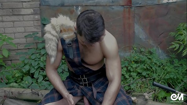 Cute shirtless guy in scottish kilt playing with cock after hard work