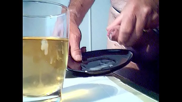 Me masturbating and ejaculating in a glas of piss