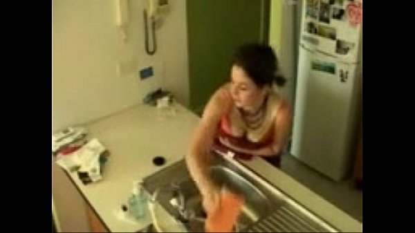 Brunette teen has an intense orgasm masturbating in the Kitchen sink