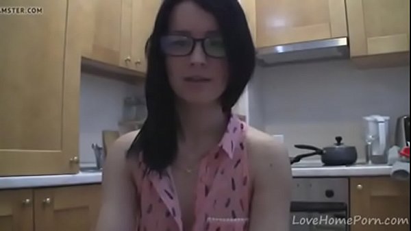 splendid teen with glasses chatting in the kitchen