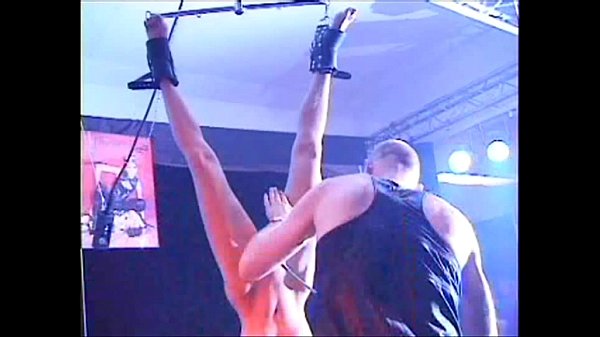 Fetish Club Punishment On Stage of blonde girl in bondage and whipping