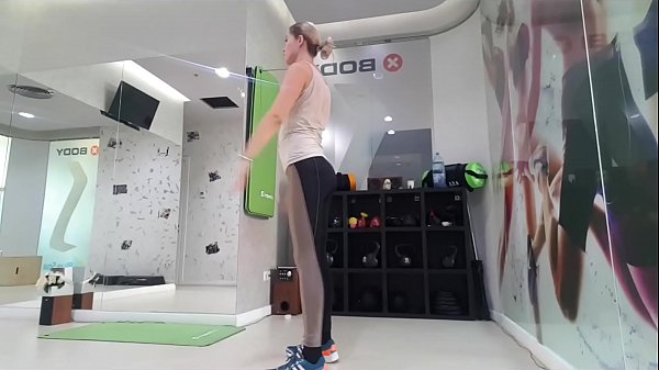 Blonde girl warming up before workout