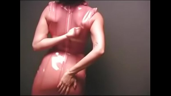 Rubbing Her Pussy in a Rubber Outfit