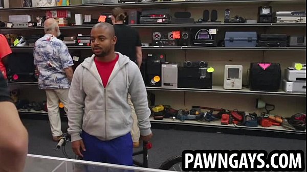 Ebony hunk tries to sell a bike at the pawn shop