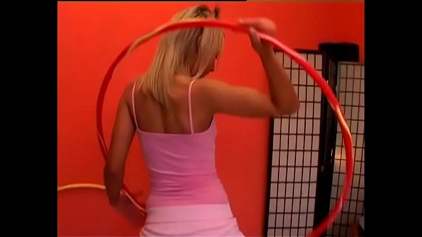 European blonde floozie Sandy Silver prepares special tricks with hoola hoop