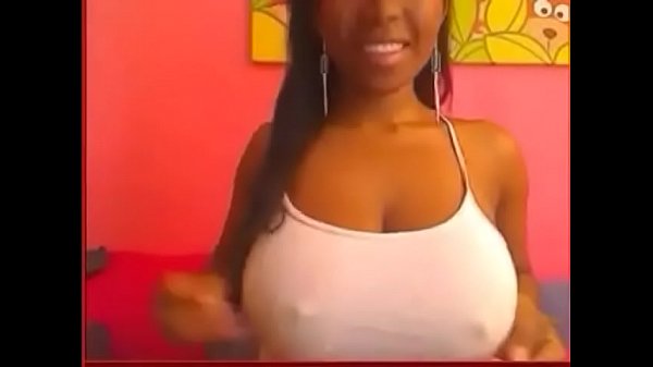 black girl teases with huge boobs in white top