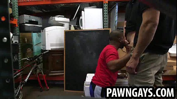 Ebony hunk sucking on two cocks at the pawn shop