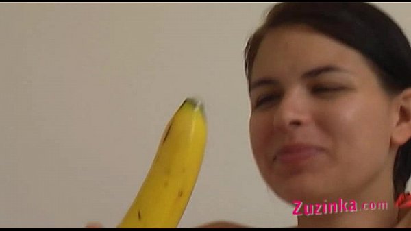 How-to: Young brunette girl teaches using a banana
