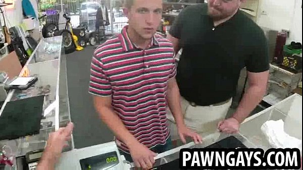 Hunk posing for some photographs at the pawn shop