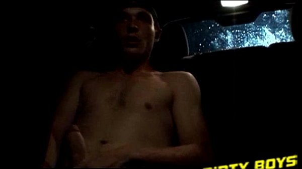 Horny amateur wanks his cock in the car and spills a load