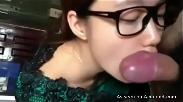 Hot brunette Asian sucks cock