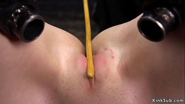 Hot brunette slut Charlotte Sartre gets her nice ass hard spanked to red then shaved pussy caned in metal device bondage