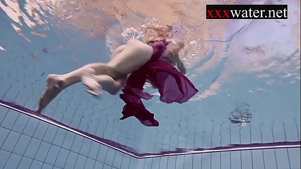 Smoking hot Russian redhead in the pool