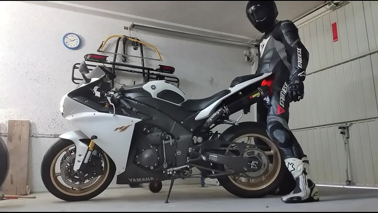 White leathered biker wanking with a Yamaha R1 motorbike