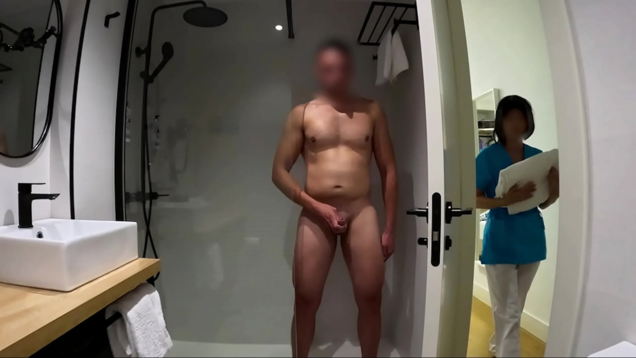 I masturbate in the bathroom, the hotel room service woman comes in to leave some towels and helps me finish, she caught me by surprise and wanted to help me finish