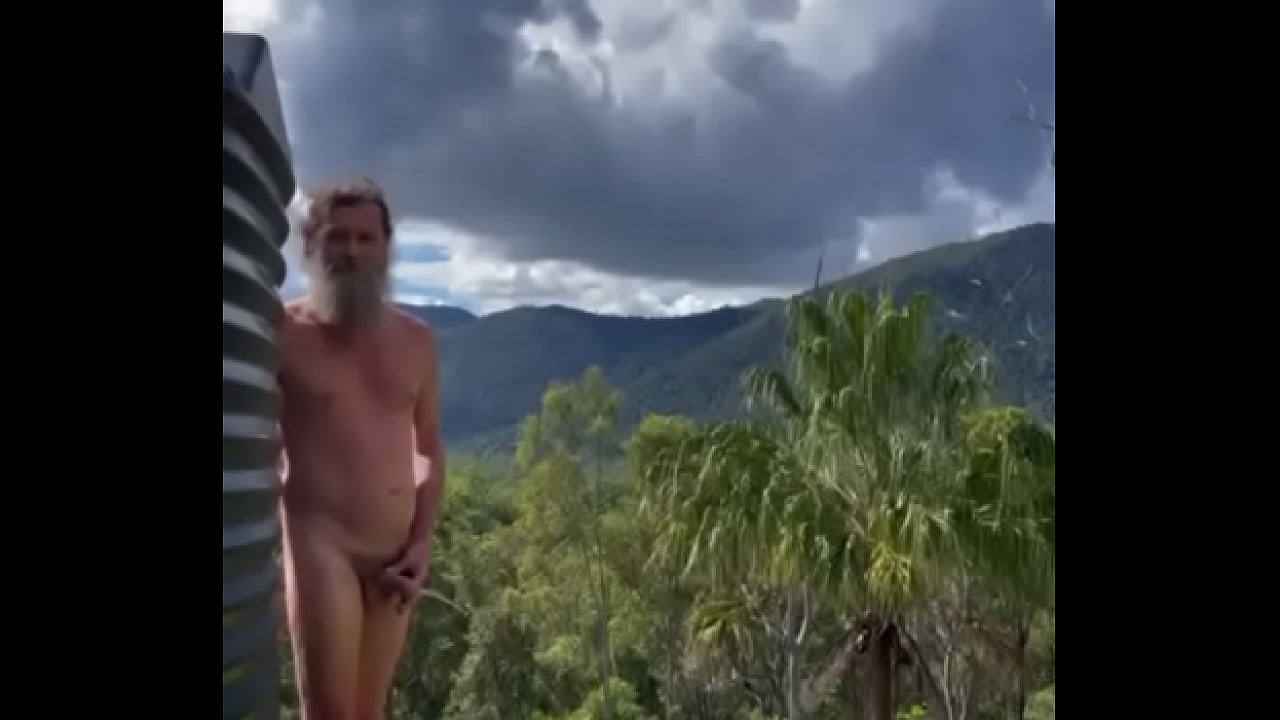 Peepee piss outdoors while naked man admires conservation reserve and nudist campground