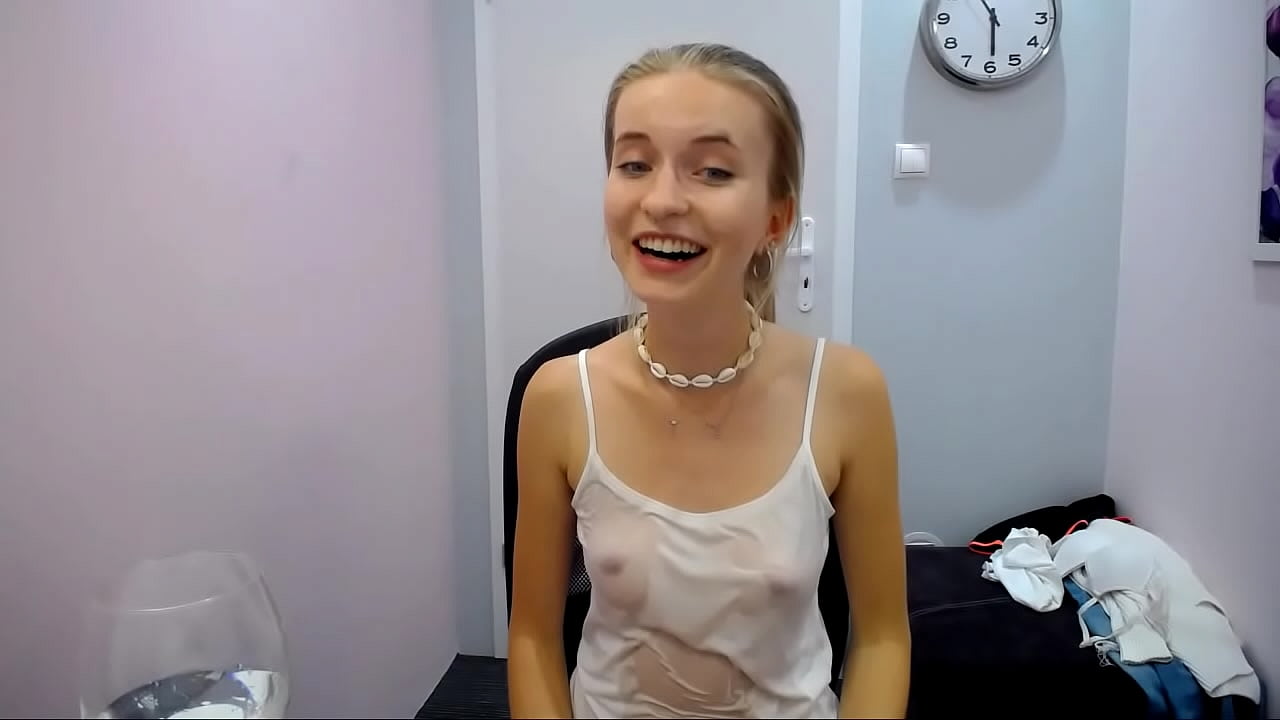 Slim blonde camgirl with small tits poses in seethrough top