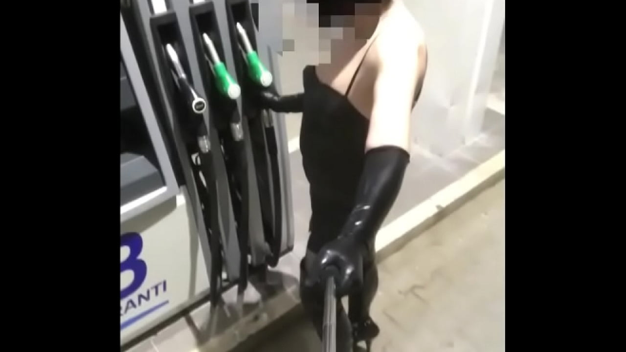 walking fetish dressed in a gas station between trucks as a real lot lizard