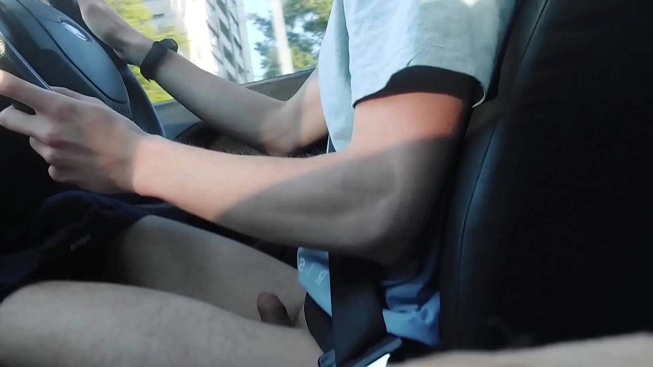 Teen aroused male exhibitionist shows off his jerkoff in a car as he drives