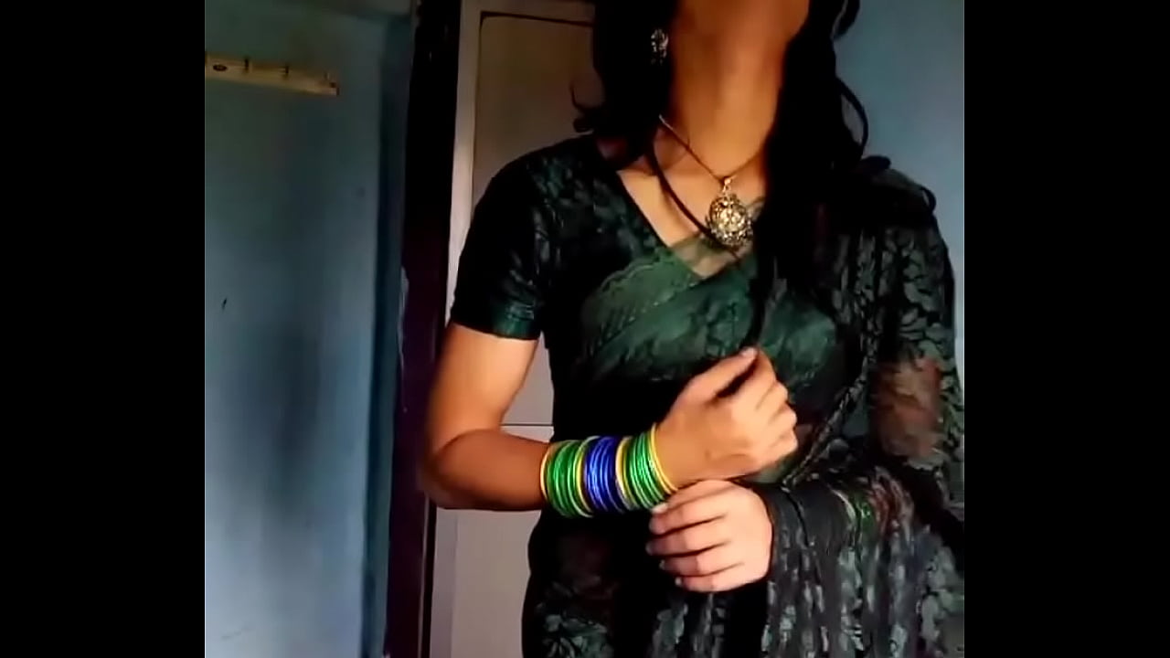 Crossdresser in green saree