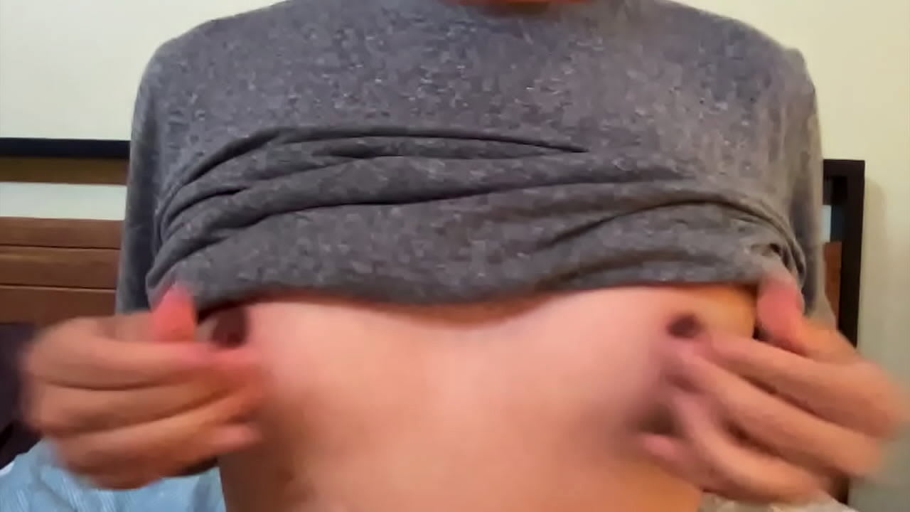 Latino squeezes his large nipples