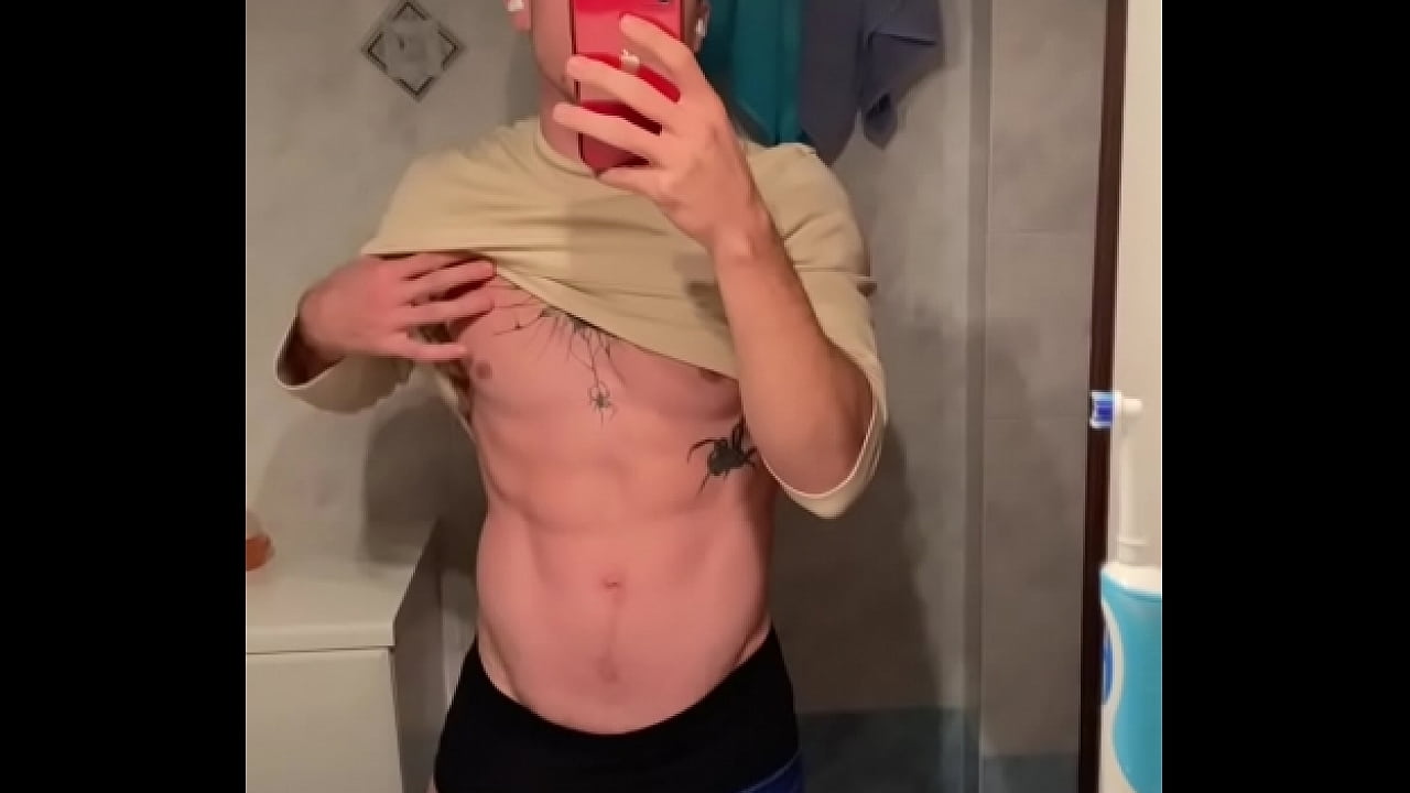 Young stud teasing with his hard cock while wearing sweatpants