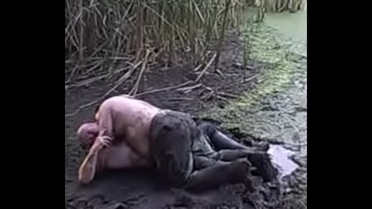 tophercubkc pisses on kspigbear, whose dick is caged, while they're playin' in the mud pit