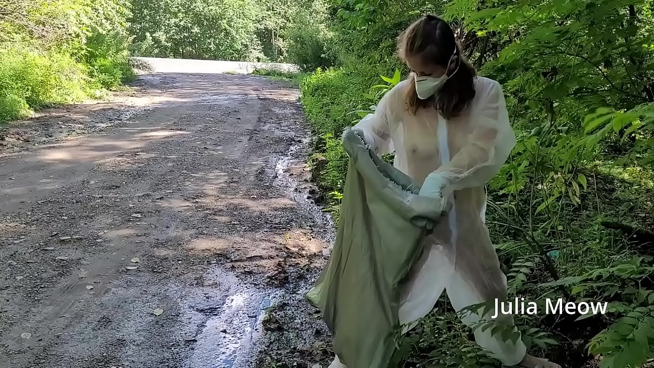 What is this crazy girl doing naked in a transparent jumpsuit on a busy road?