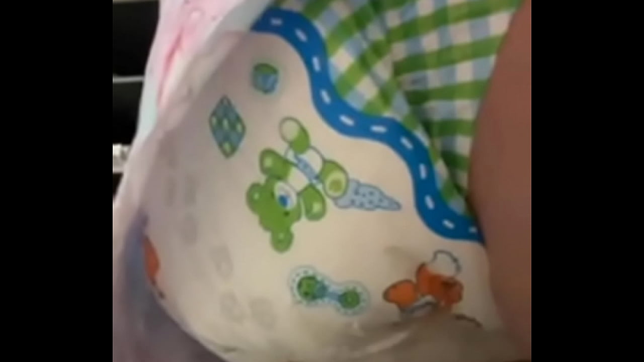 Diaper girl fills nappy then squishes around