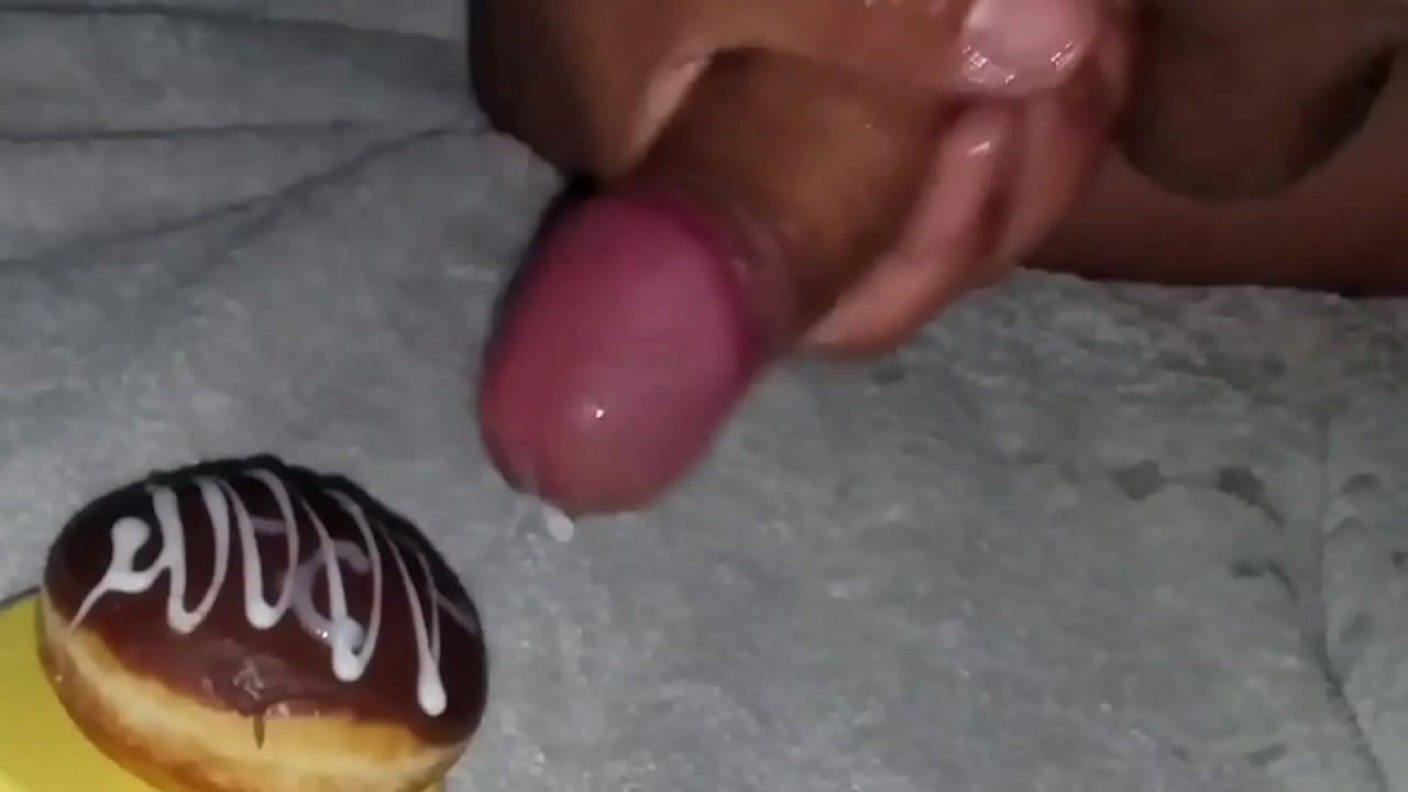 Chocolate donut gets cum covered and eaten.