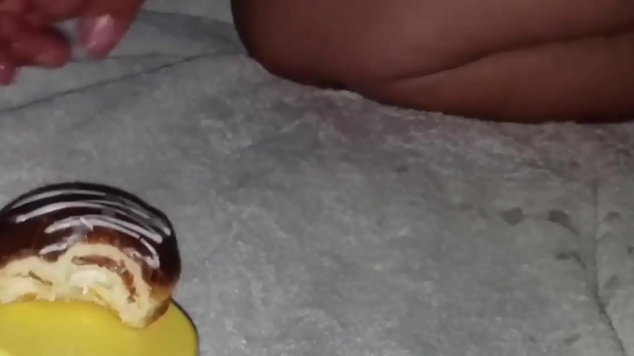 Chocolate donut gets cum covered and eaten.