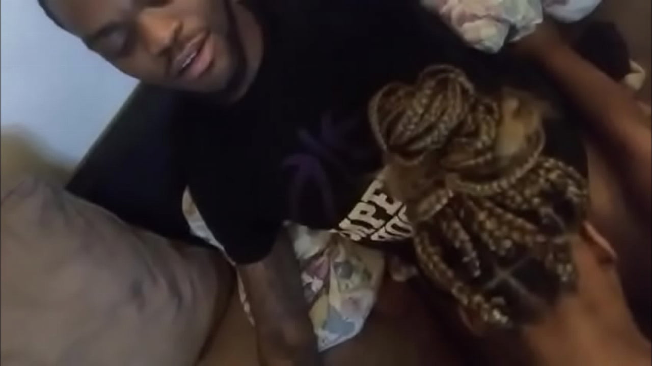 Black slut gives head while being recorded with selfie stick