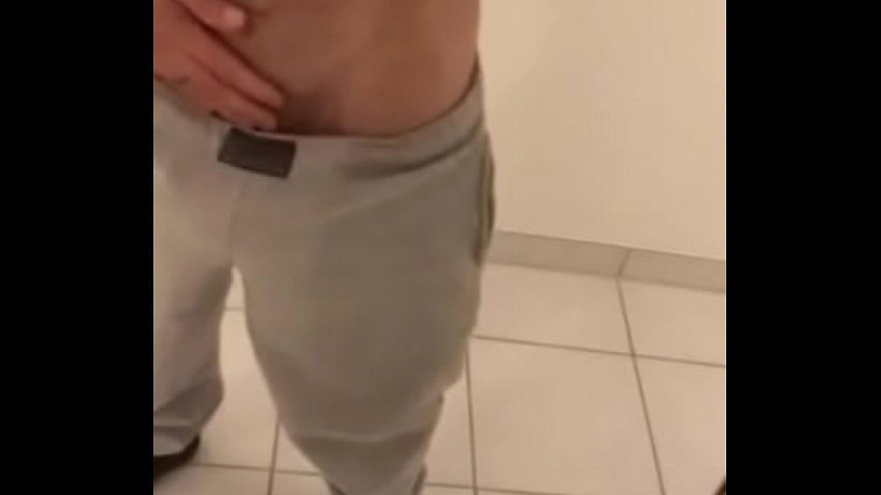 Latin boy stripping and playing with cock in bathroom