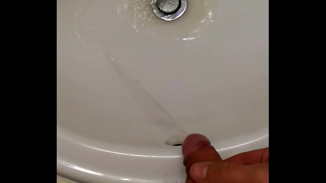 Pissing in hotel bathroom sink