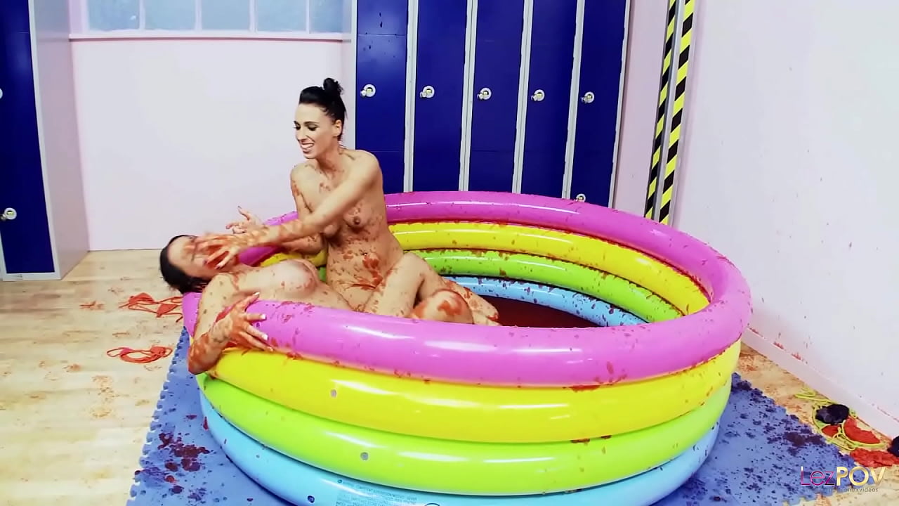 Silly British lesbians jump in a pool of jello and begin wrestling before they get aroused and kiss
