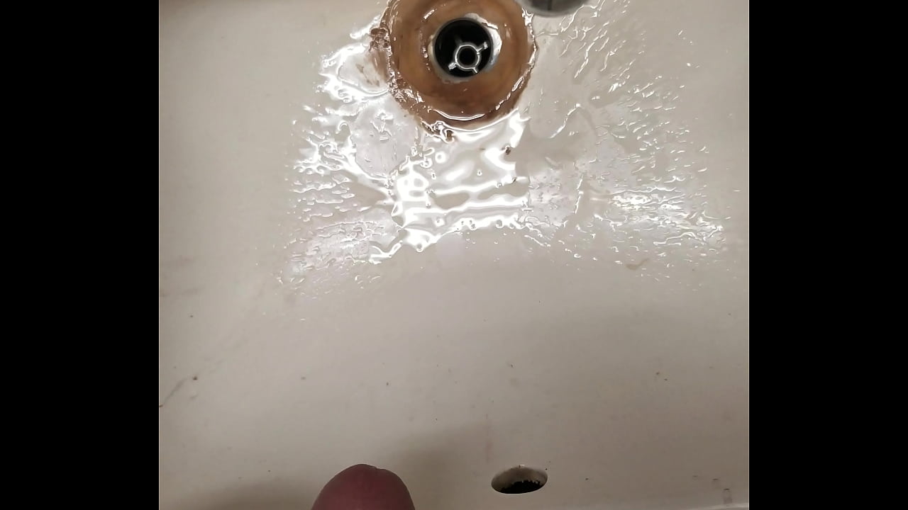 Pissing in a sink at work